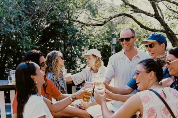 a group of friends with drinks on a sunny day